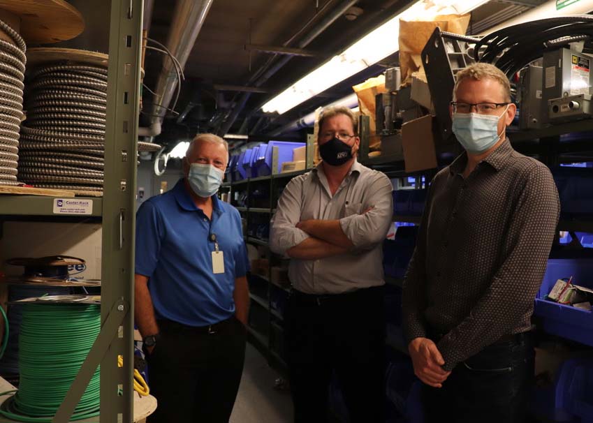 Sheldon Gouthro, Tim Ross and Ian Wagschal, wearing protective masks in the facilities workshop.