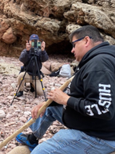 student recording an interview with Eskasoni community member for Reporting in Mikmaki field course.