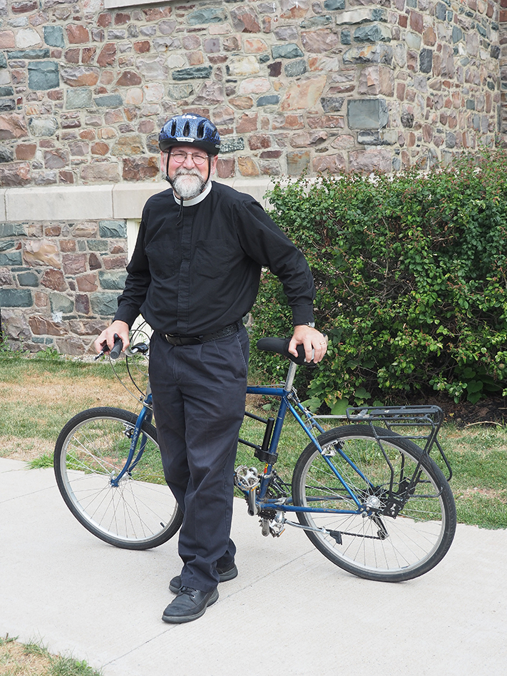 Ranall Ingalls next to his bicycle