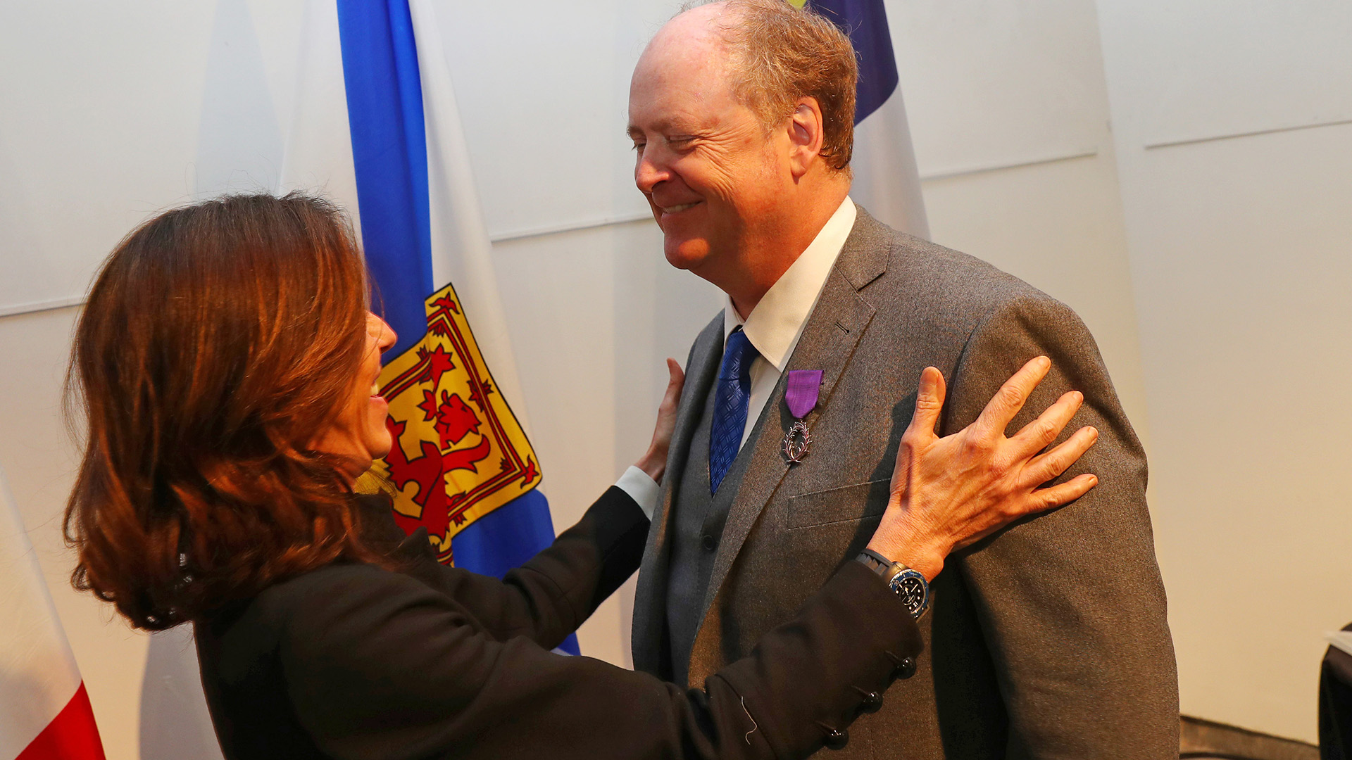 Chris Elson receives his award from the French Ambassador