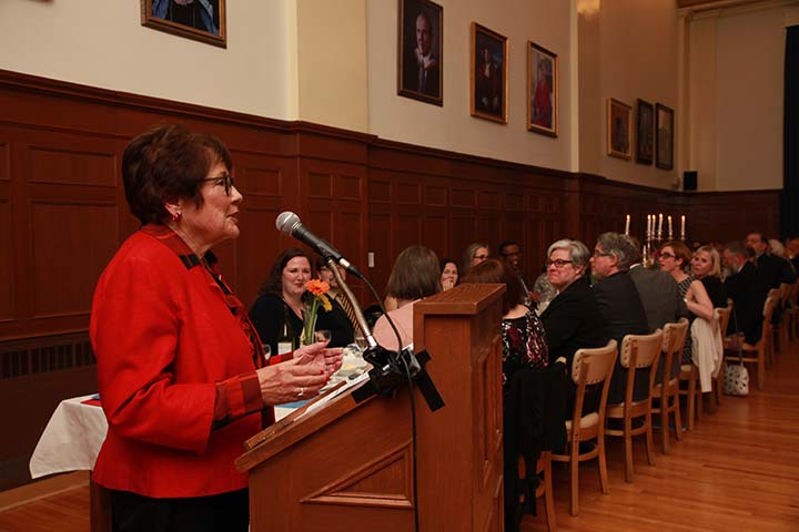 Dale Godsoe speaks at a podium at the President's Dinner.