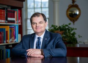 President and Vice-Chancellor William Lahey, seated in the King's library