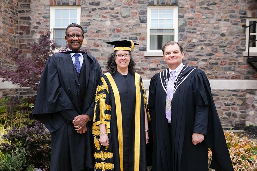 Board of Governors Chair Douglas Ruck, Chancellor Debra Deane Little and President William Lahey, in academic robes on King's campus.