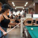 A King's student lines up the cue in HMCS King's Wardroom, a student-run campus canteen, pub, and study area.