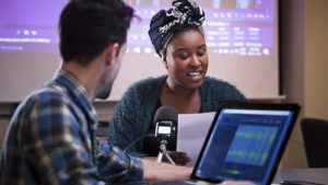 A student delivers a radio journalism report