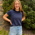 Nicole Ponto standing in front of bush outside at King's