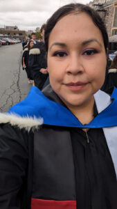 One year Bachelor of Journalism grad Crystal Green in the procession at her Encaenia in 2023.