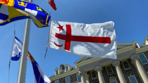 Mi'kmaw flag fluttering on mast in King's Quad