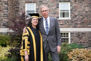 Chancellor Debra Deane Little in ceremonial robes and her husband Robert in King's Quad
