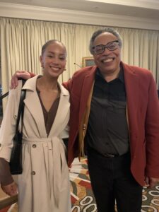 Sophia Wedderburn stands to the right of Dr. George Elliott Clarke at the USS Conference in Halifax, October 2023