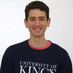 Sobey Scholar winner Noam Koubi wearing King's sweatshirt and smiling to camera