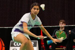 Ritu Shah focuses as the badminton bird comes toward her - she is ready with a backhand