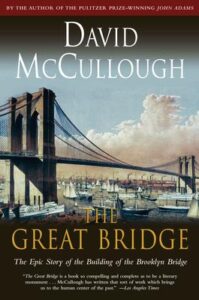 book cover of The Great Bridge by David McCullough, with a painting of the Brooklyn Bridge and sailing ships filling the river underneath