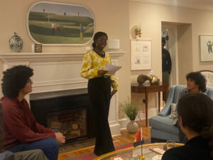 Dáminí Awóyígà delivers remarks at Black student mixer at the President's Lodge.